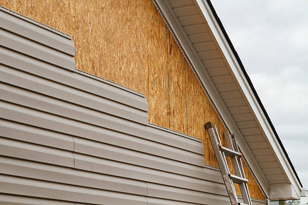Professional Emergency Siding Repair technician working in Bowie, TX
